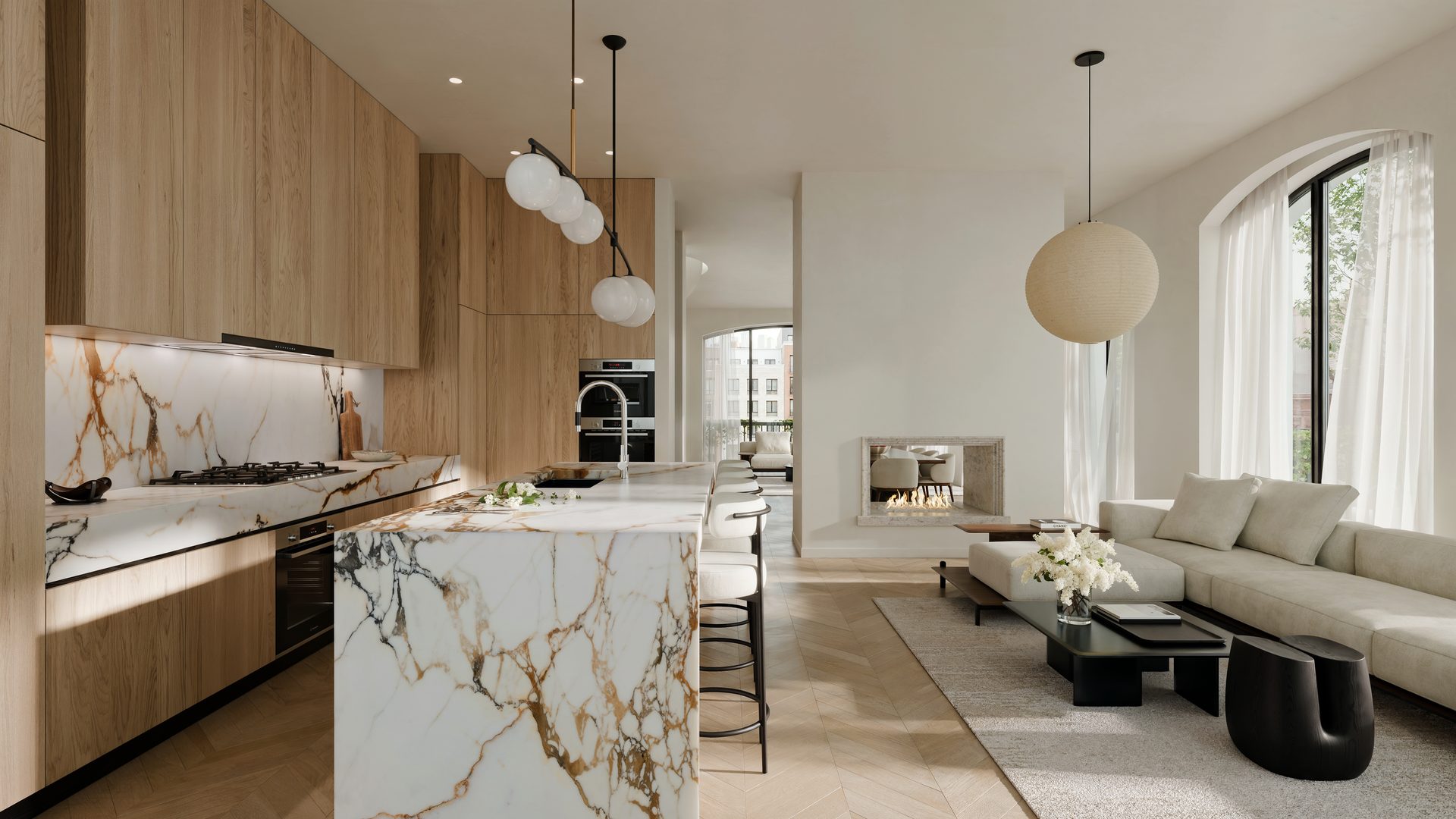 Kitchen with marble island opening onto the living room